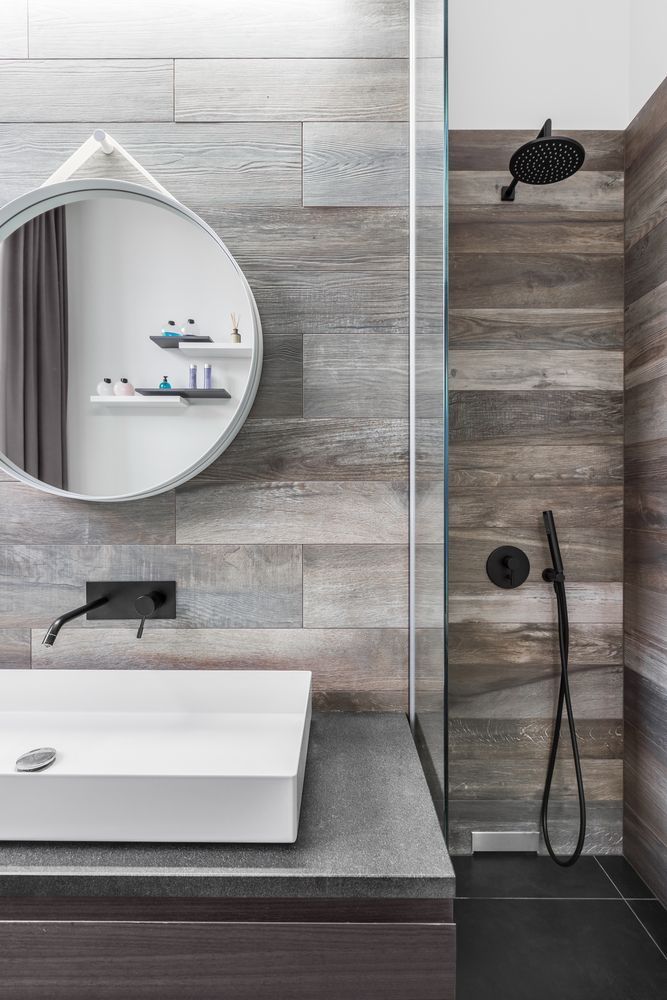 A Bathroom With A Sink, Mirror And Shower — Hutchisons Tile Centre In Mullumbimby, NSW