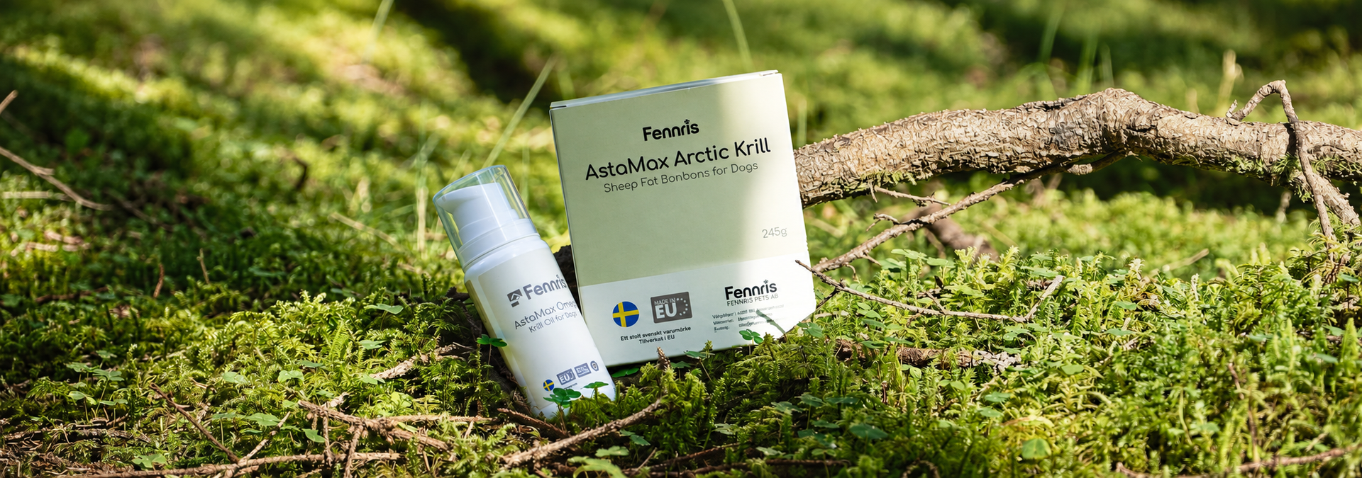 White cosmetic tube and card on moss in sunlight with blurred greenery background