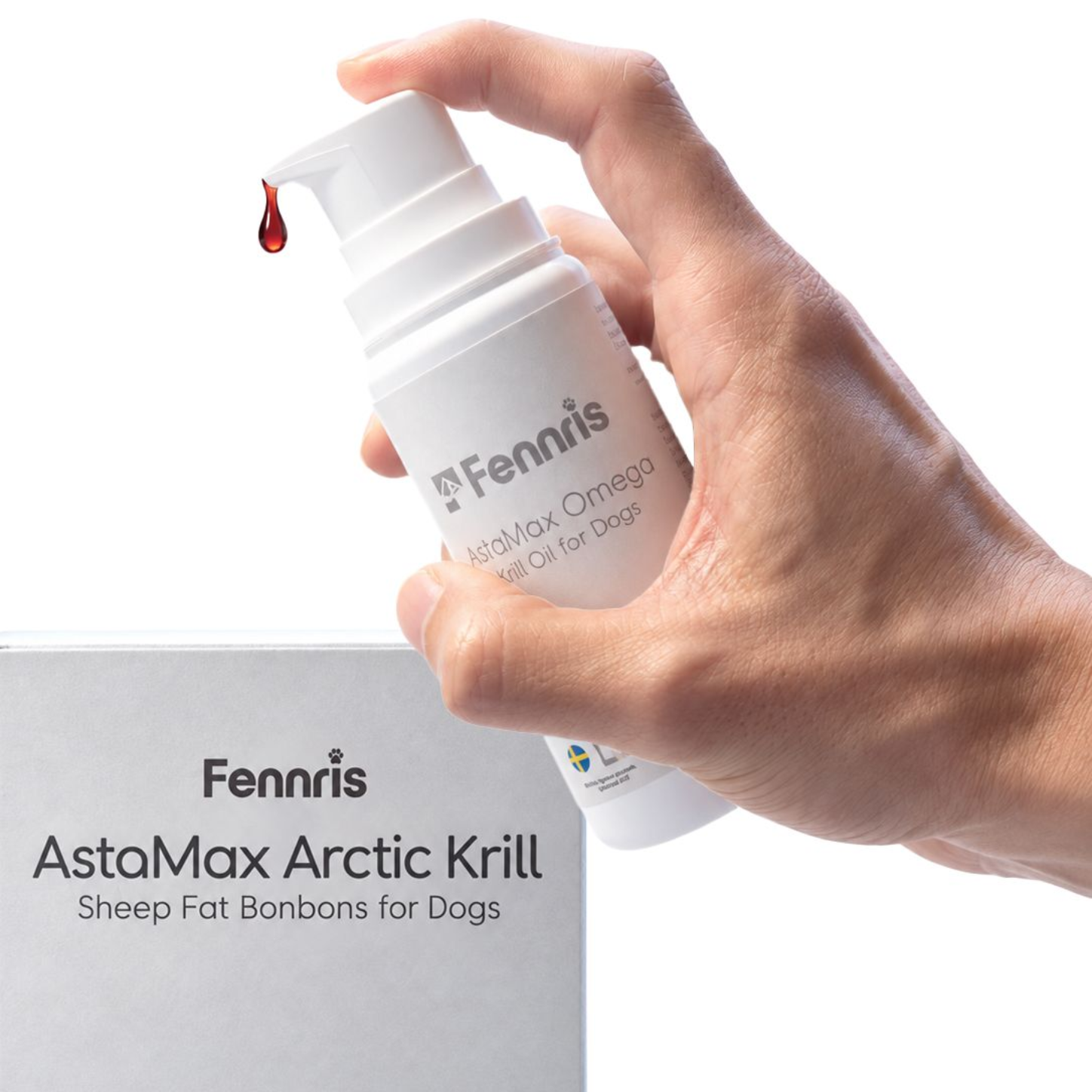 Hand holding a white Fennris AstaMax Arctic Krill dog supplement bottle with a red drop on the dispenser tip