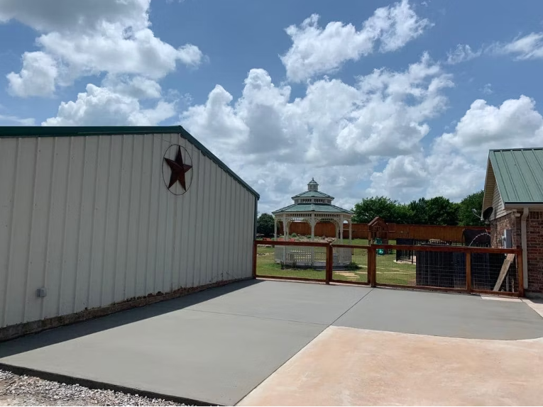 Modern navy-blue kitchen with sleek cabinets, white backsplash, and under-cabinet lighting.