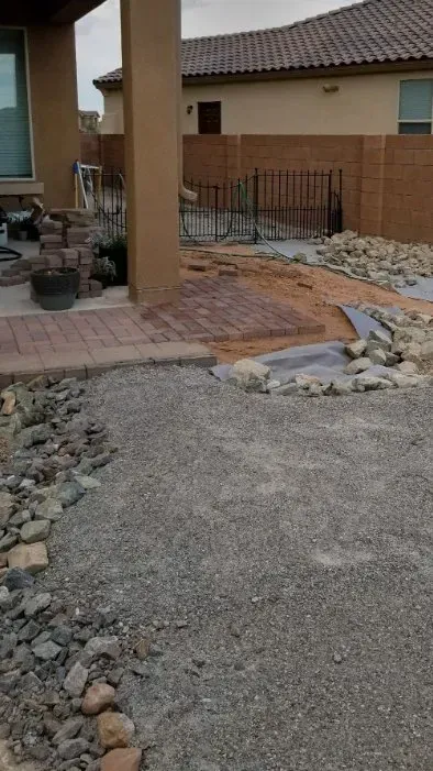 A design incorporating an arroyo to direct water below a future patio site.