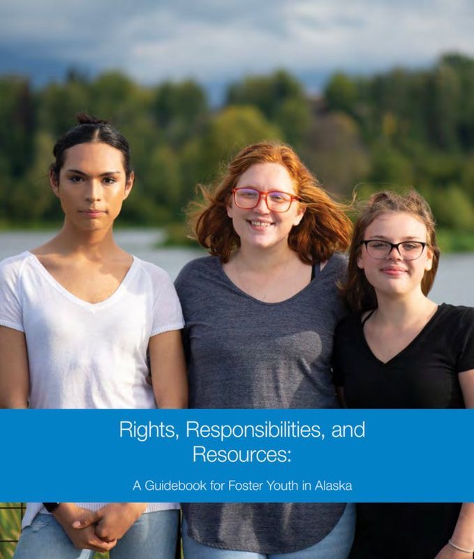 Three people standing outdoors with blue banner reading “Rights, Responsibilities, and Resources”