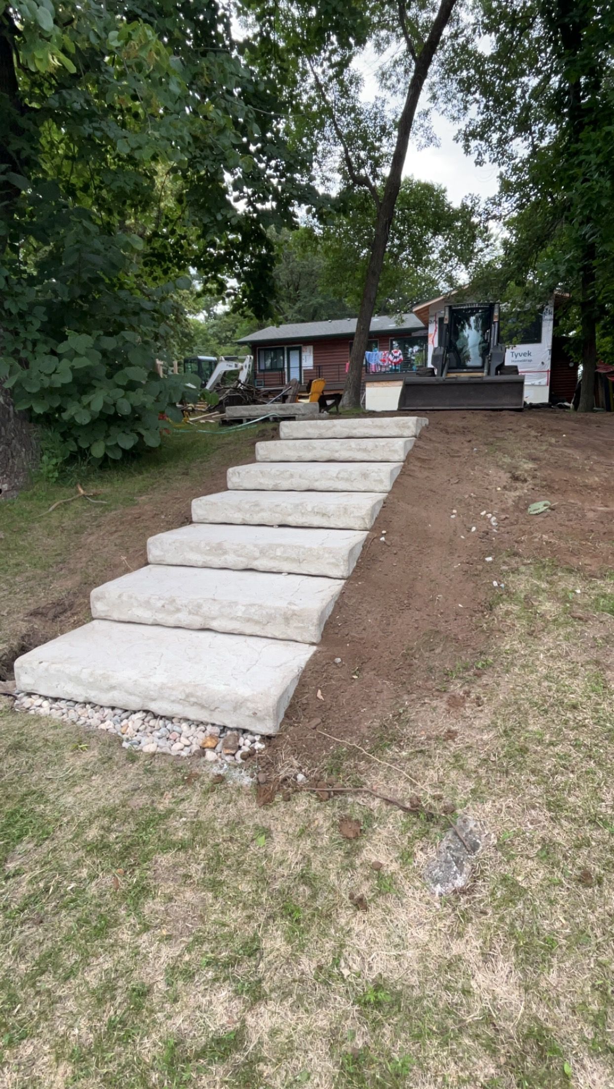 A set of concrete steps leading up to a house.