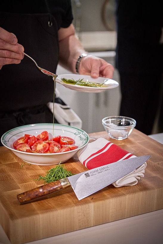 Chef Pat Drizzling Olive Oil on Tomatoes
