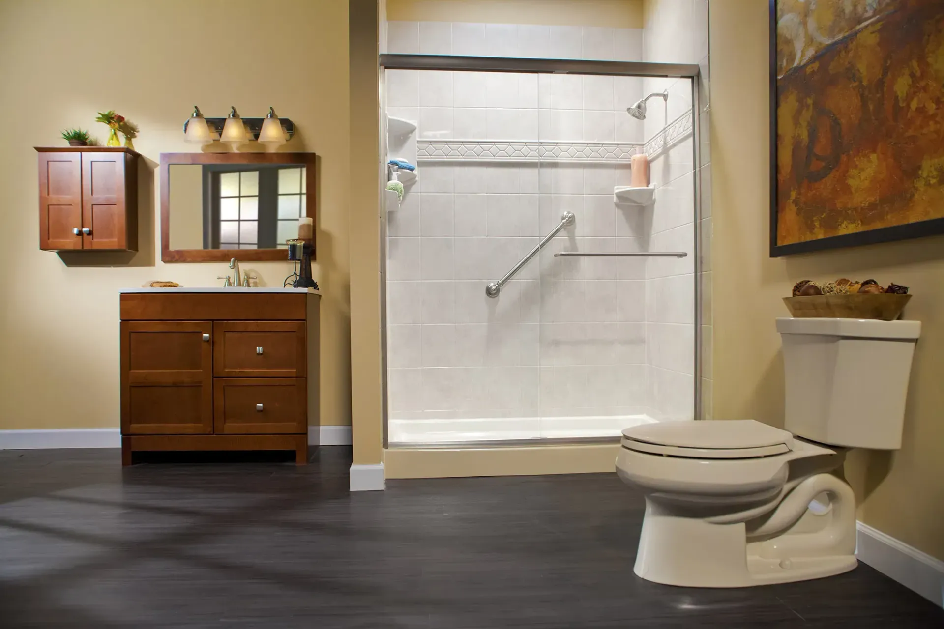 Accessible bathroom with walk-in shower, wooden vanity, and toilet in a modern interior.