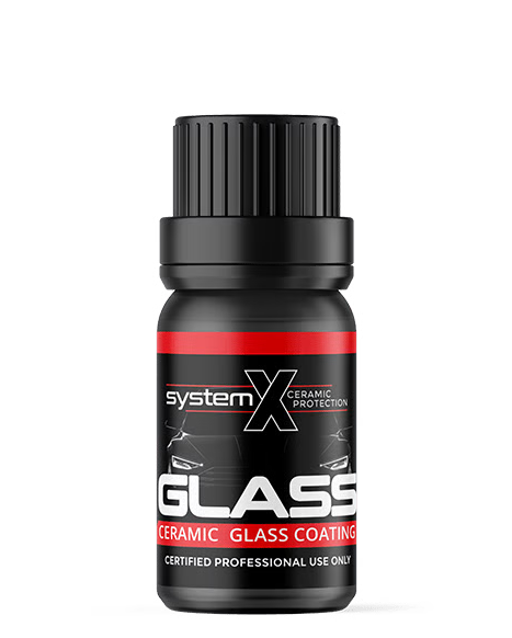 Black bottle of System X Glass ceramic coating for glass protection. Red and white label.