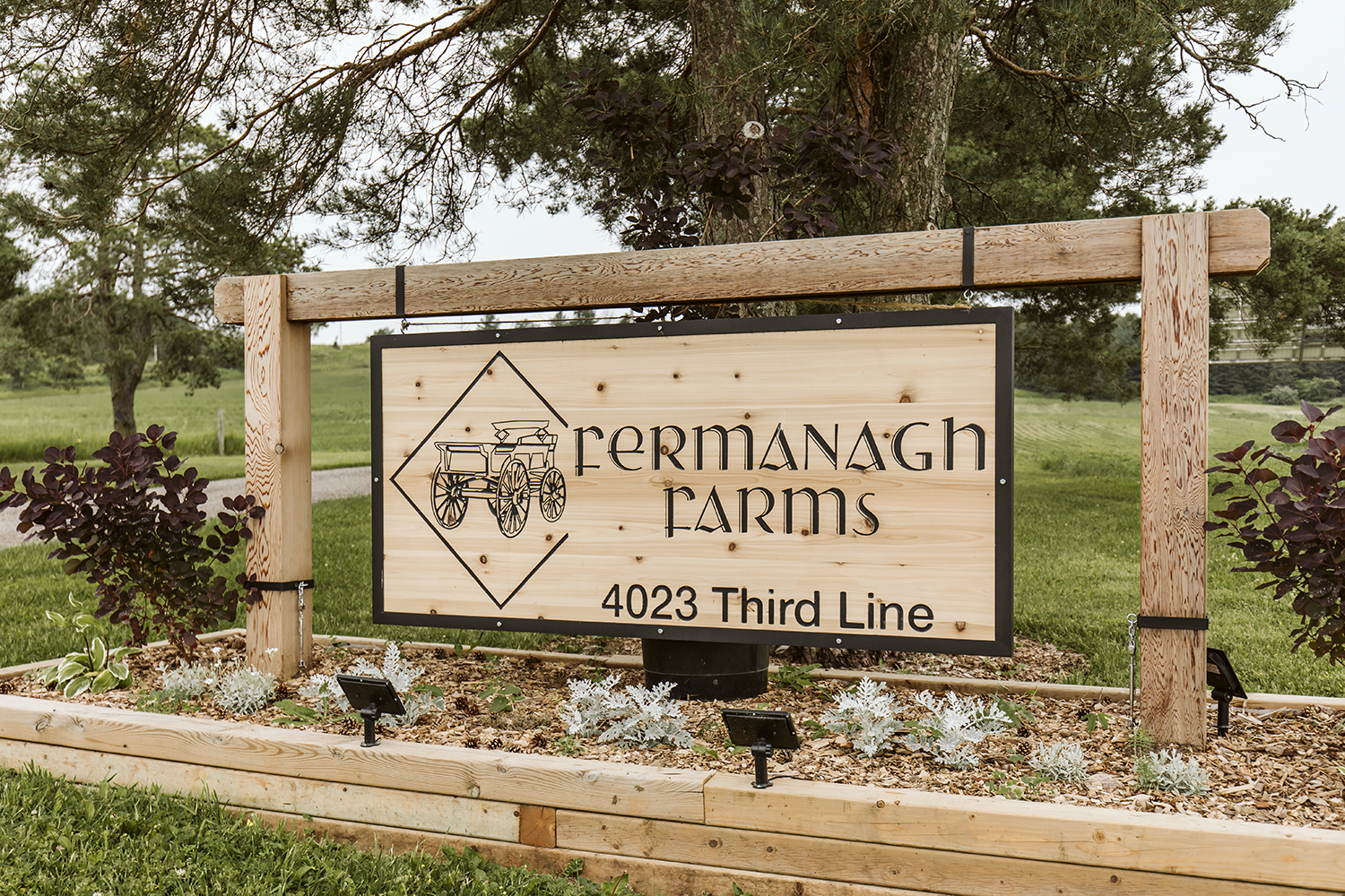 A wooden sign that says fermanagh farms on it