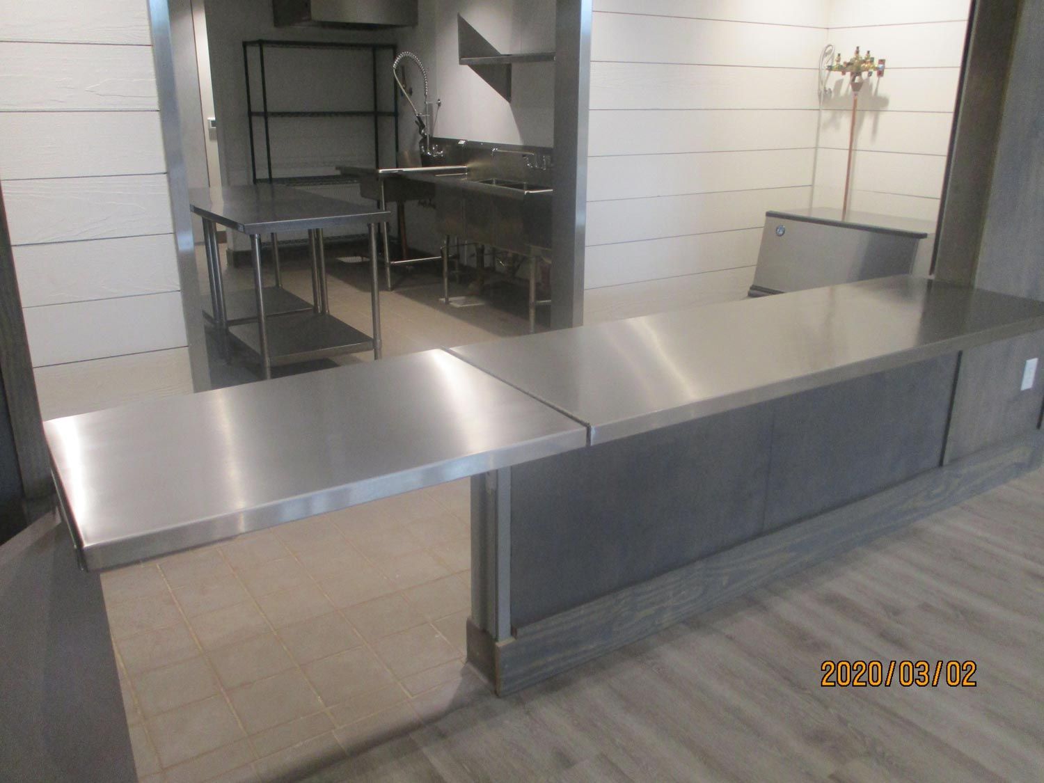 A kitchen with a sleek stainless steel counter top and sink- San Antonio, TX - Texas Sheet Metal