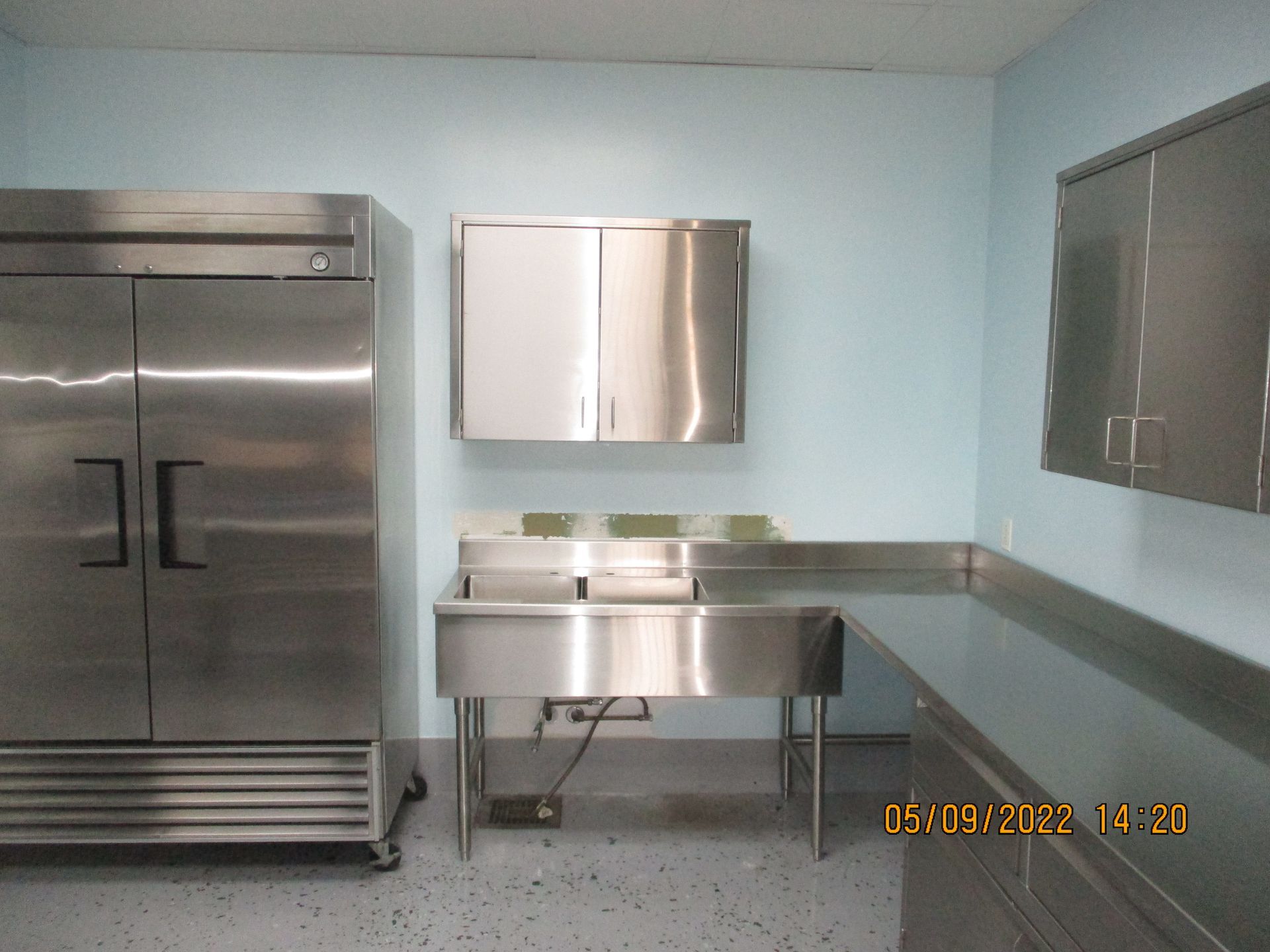 A Kitchen with Stainless Steel Appliances including a Refrigerator | San Antonio, TX | Texas Sheet Metaland a sink