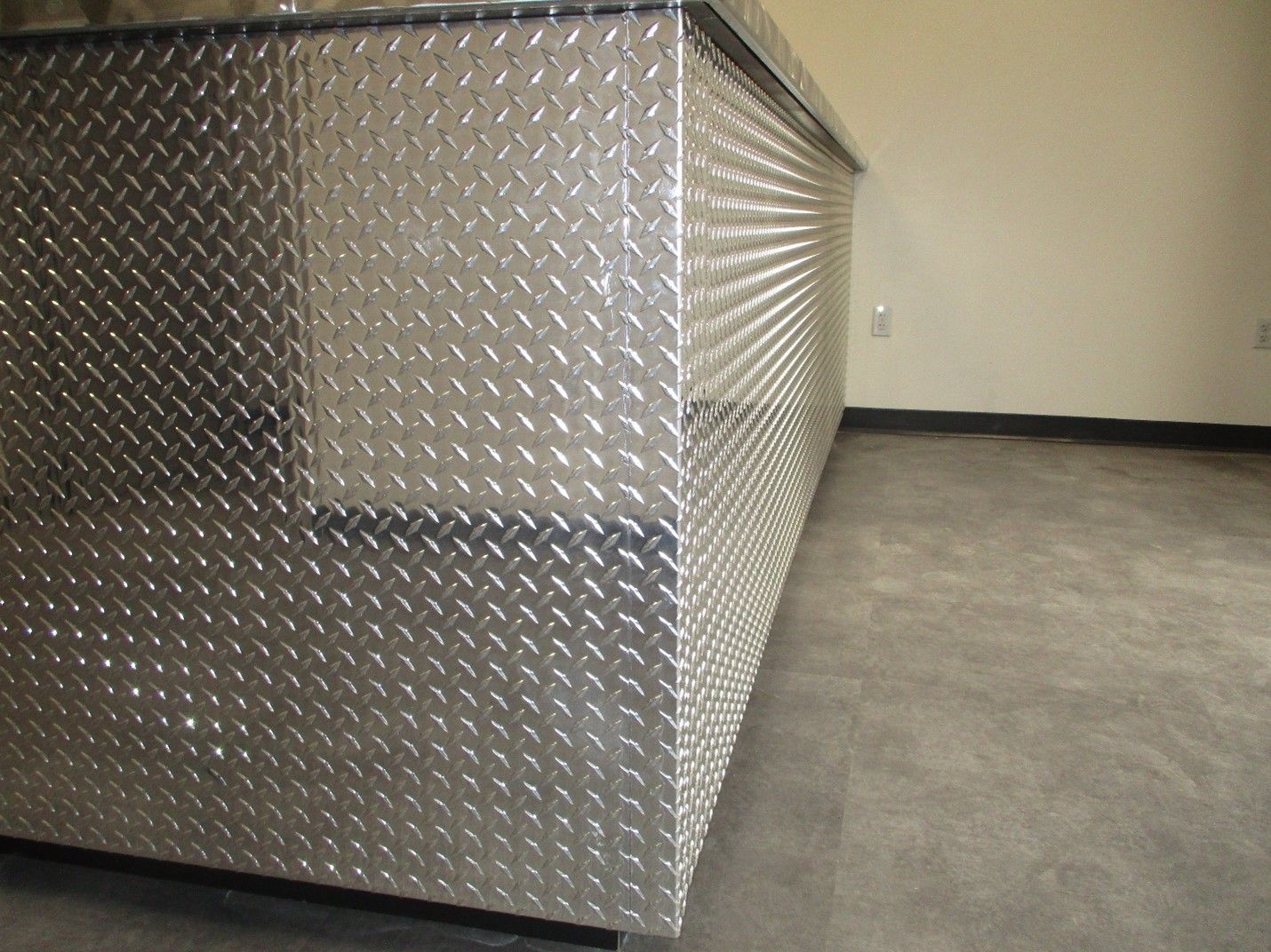 A Metal Wall with a Diamond Plate Pattern on it | San Antonio, TX | Texas Sheet Metal
