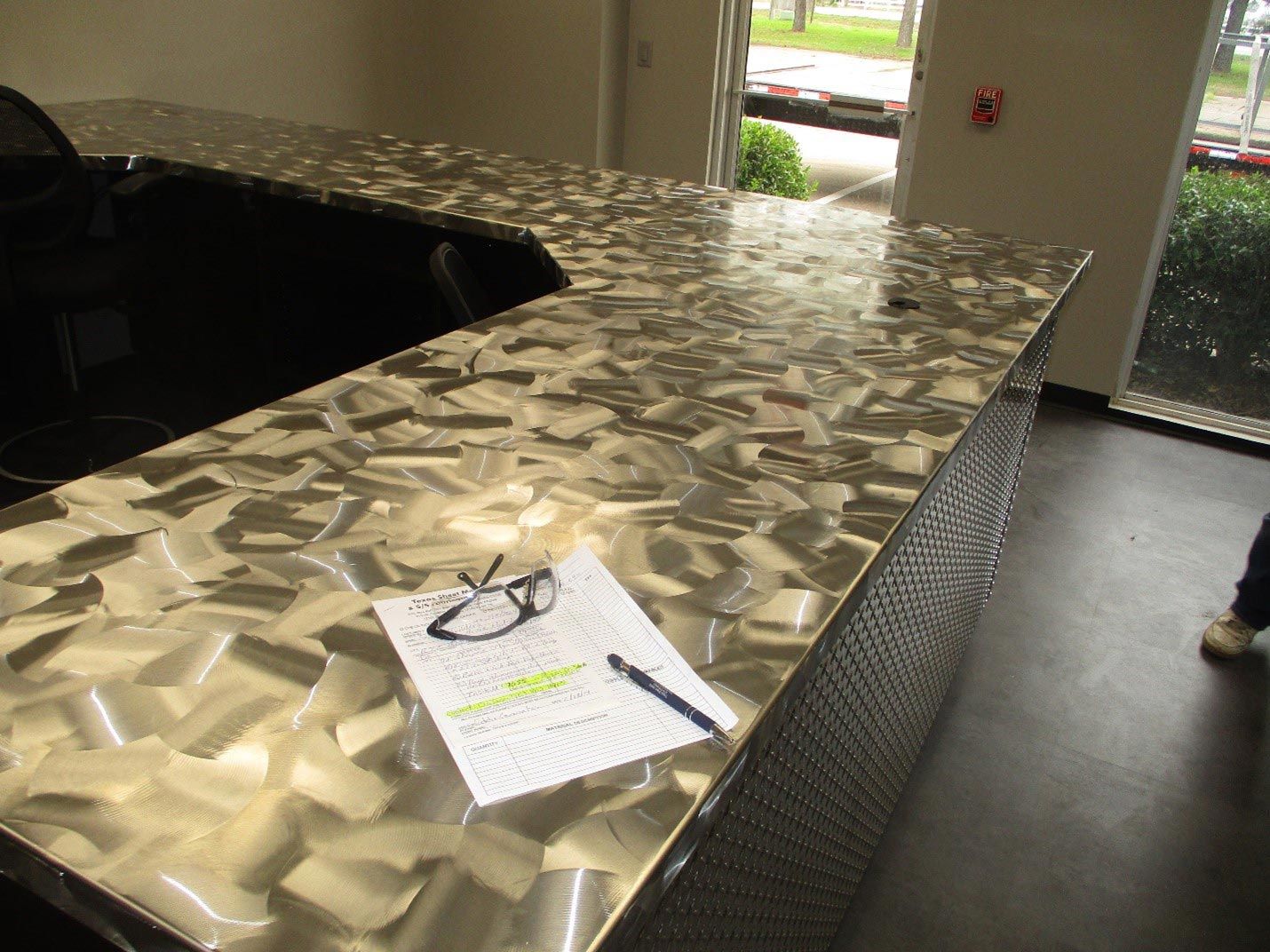  A desk covered in metal objects and tools - San Antonio, TX - Texas Sheet Metal