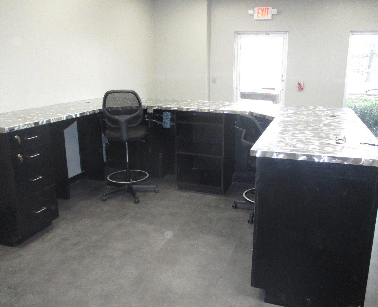 A spacious office with sleek black cabinets and chairs - San Antonio, TX - Texas Sheet Metal