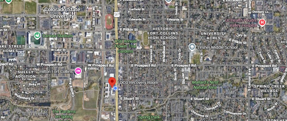 Satellite map of a residential neighborhood with several colored location pins