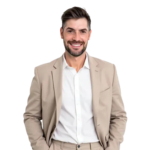 Smiling man in beige blazer and white shirt, standing against a plain white background.
