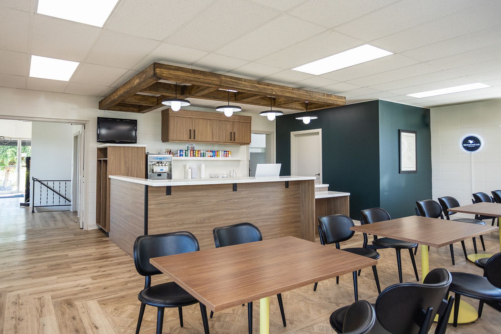 Brock Golf Clubhouse lounge with comfortable seating and warm, inviting design and abstract golf artwork