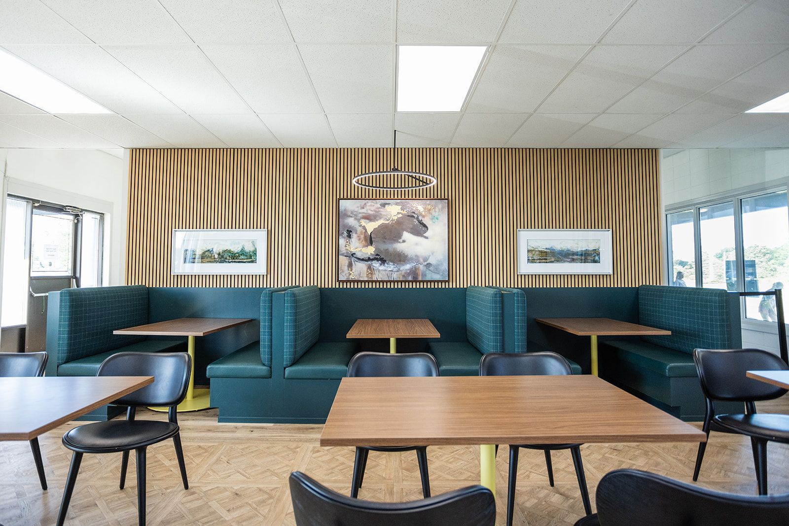 Brock Golf Clubhouse lounge with comfortable seating, modern planters and warm, inviting design.
