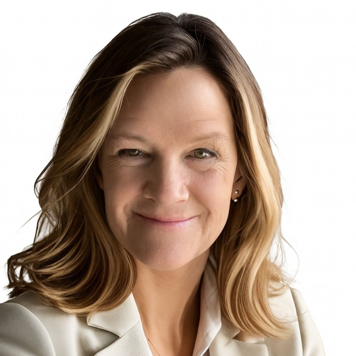 Smiling woman in a white blazer against a plain white background