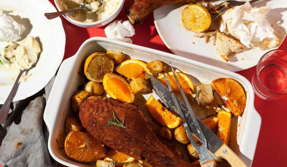 A vintage enamelware plate with roasted meats
