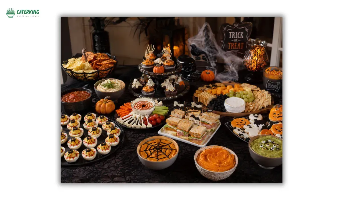 Halloween appetizer table filled with spooky finger foods dips and party snacks