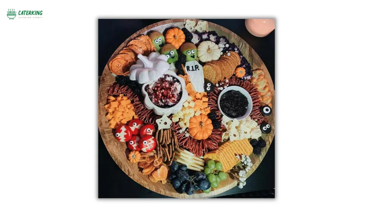 Halloween charcuterie board with festive orange black and white ingredients