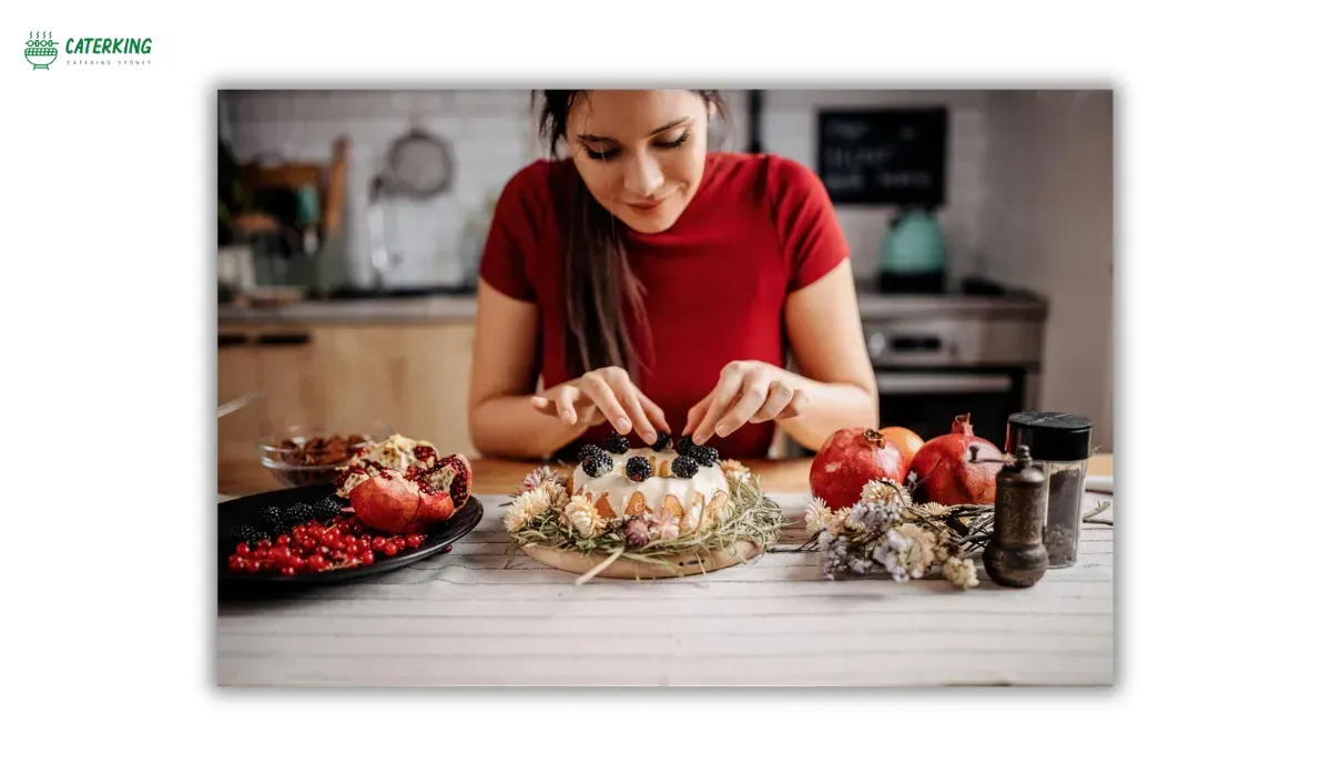 decorating an autumn birthday cake in a home kitchen
