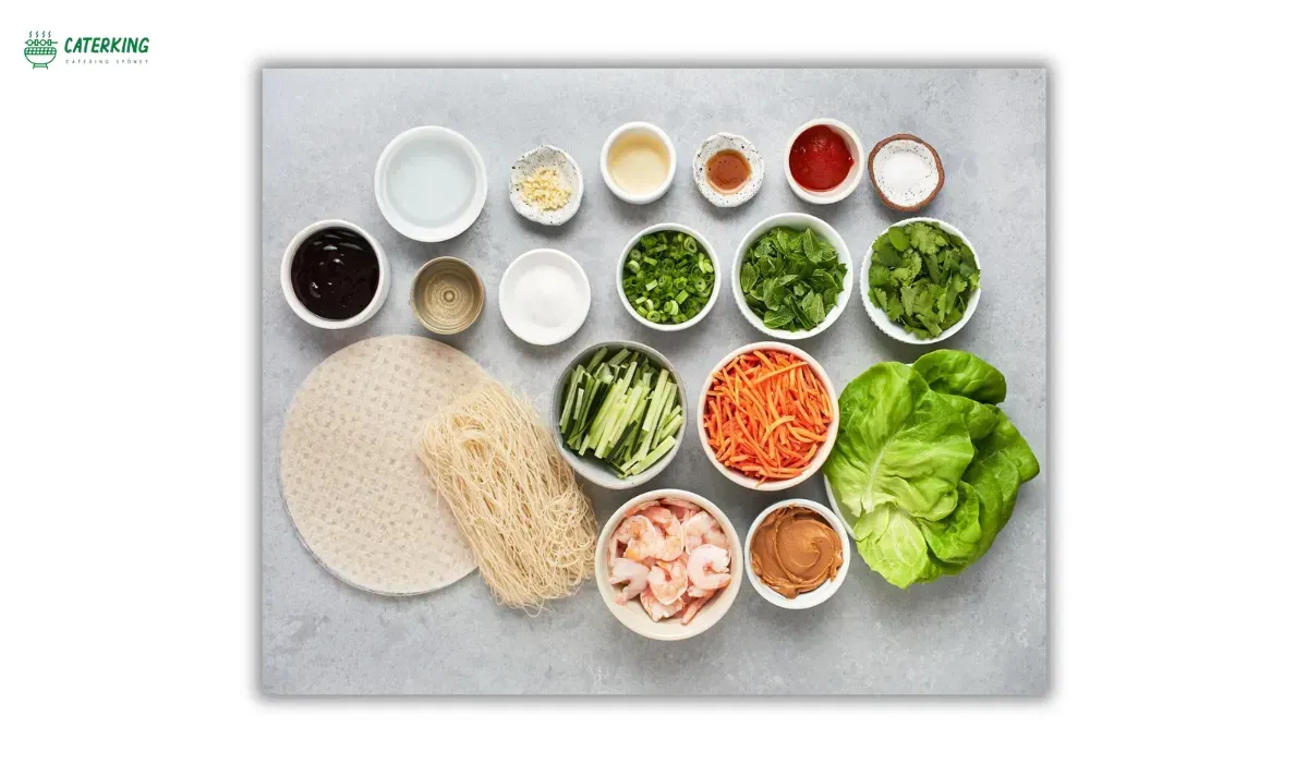 essential ingredients for Vietnamese rice paper rolls including prawns herbs vermicelli and lettuce
