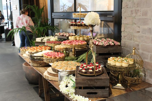 Modern wedding reception featuring styled tables and floral centrepieces