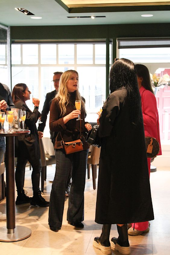See cocktail-style catering setups for indoor birthday events Guests enjoying drinks and conversation at a catered birthday celebration