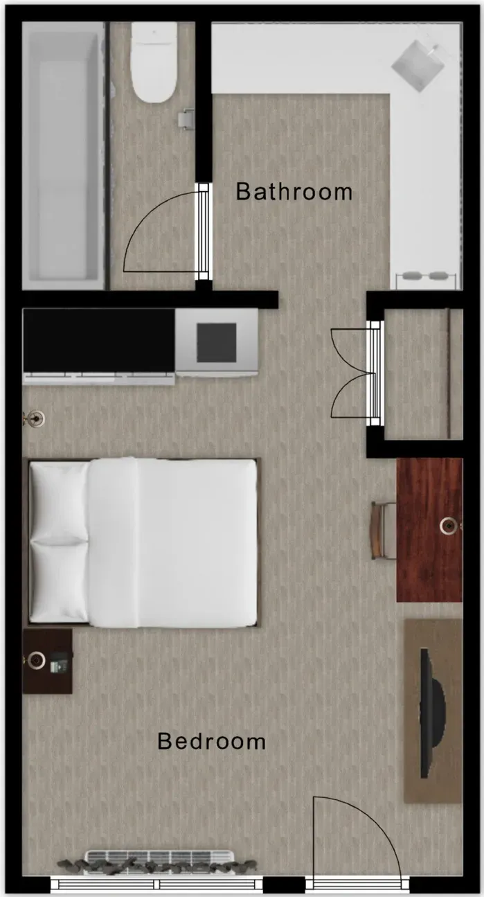 Floor plan of a studio apartment: bedroom, kitchenette, bathroom, and entrance area.
