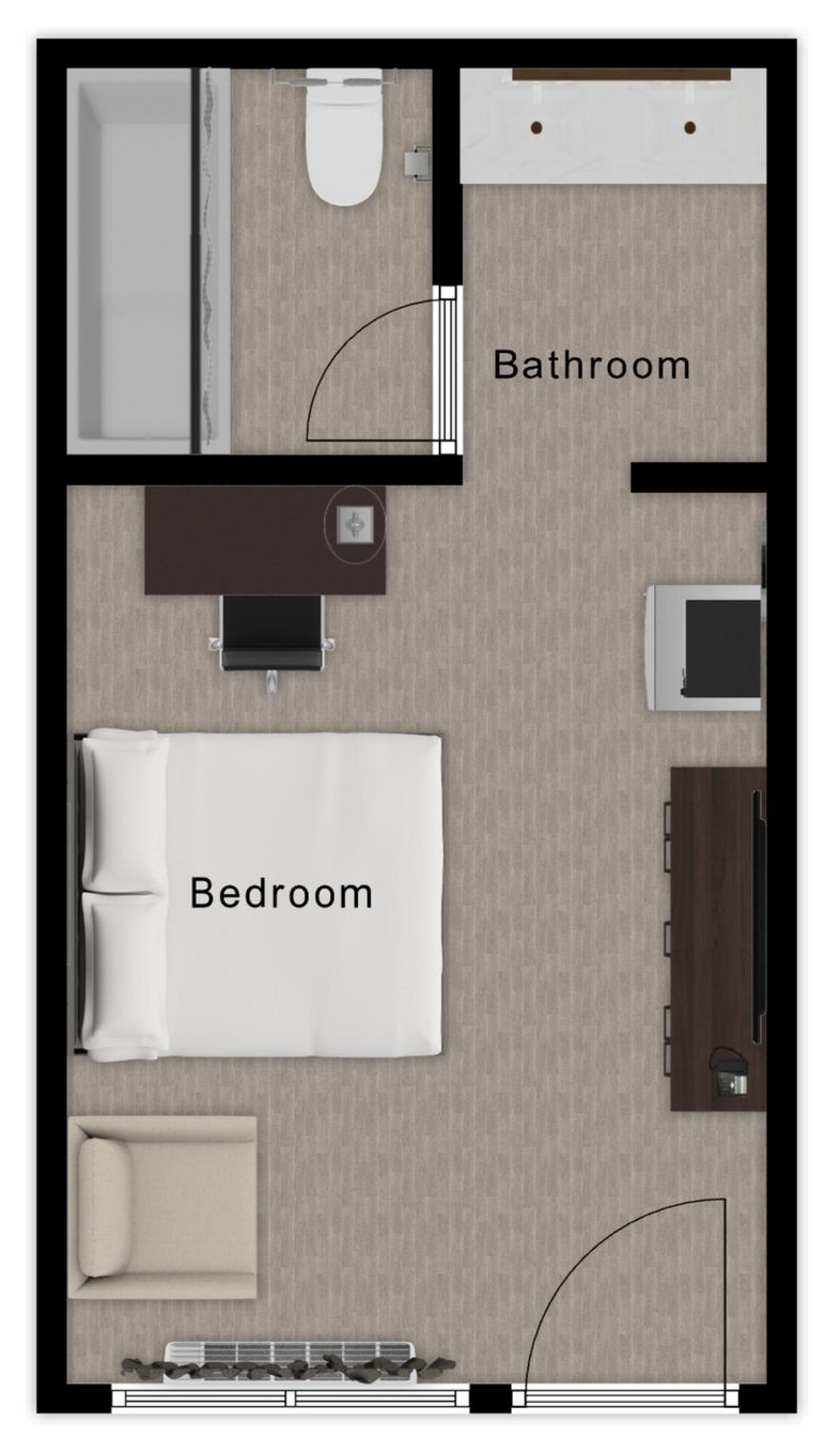 Floor plan of a studio apartment, including a bathroom, bedroom with bed, desk, chair, and TV.