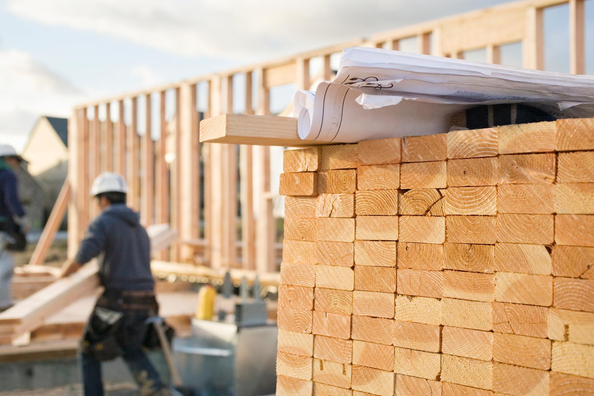 Stacked Lumber and Blueprints at a Construction Site | Brisbane, Qld | Virginia Building Supplies Stacked Lumber and Blueprints at a Construction Site | Brisbane, Qld | Virginia Building Supplies