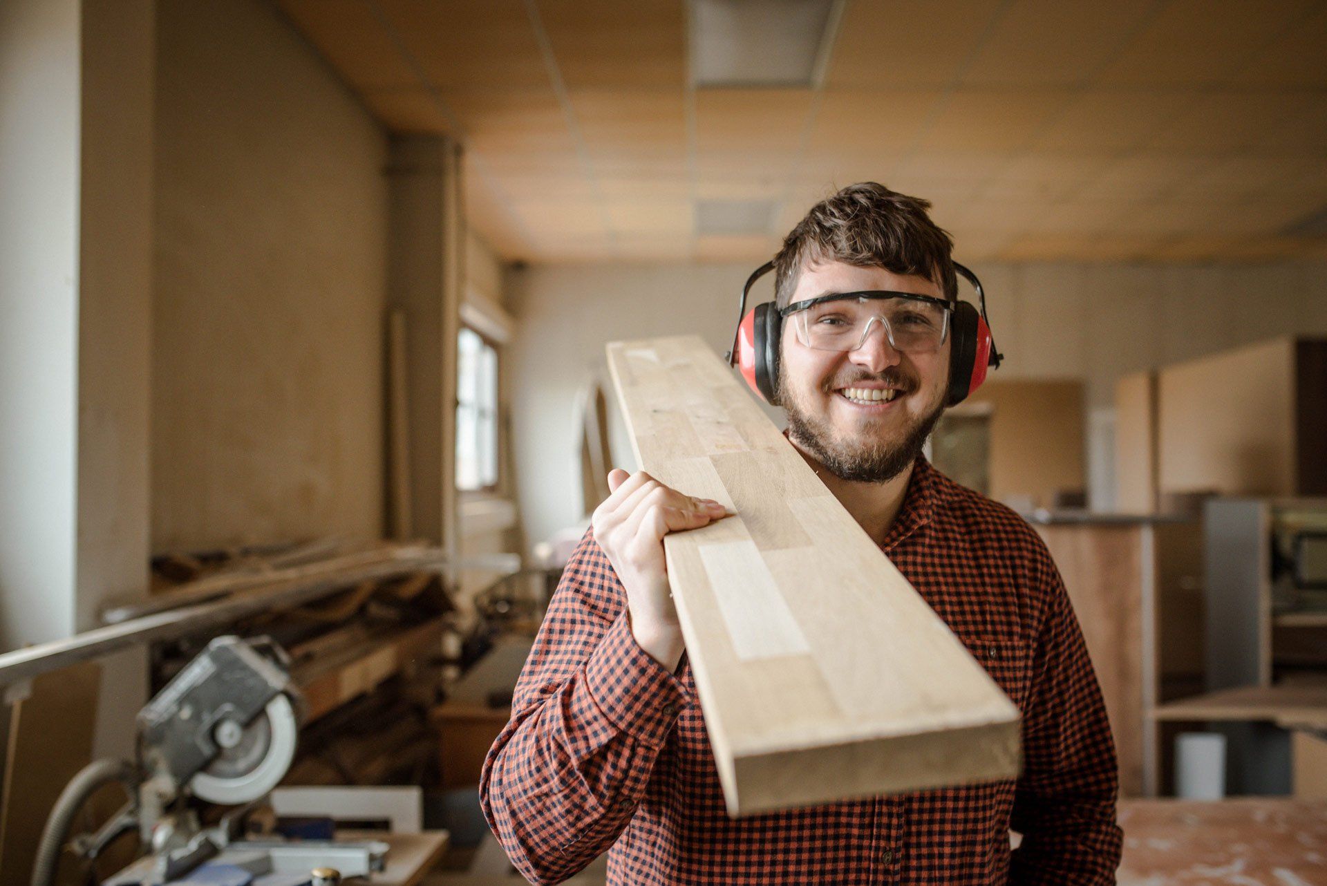 A Carpenter Carries a Massive Beam at His Workplace | Brisbane, Qld | Virginia Building Supplies A Carpenter Carries a Massive Beam at His Workplace | Brisbane, Qld | Virginia Building Supplies