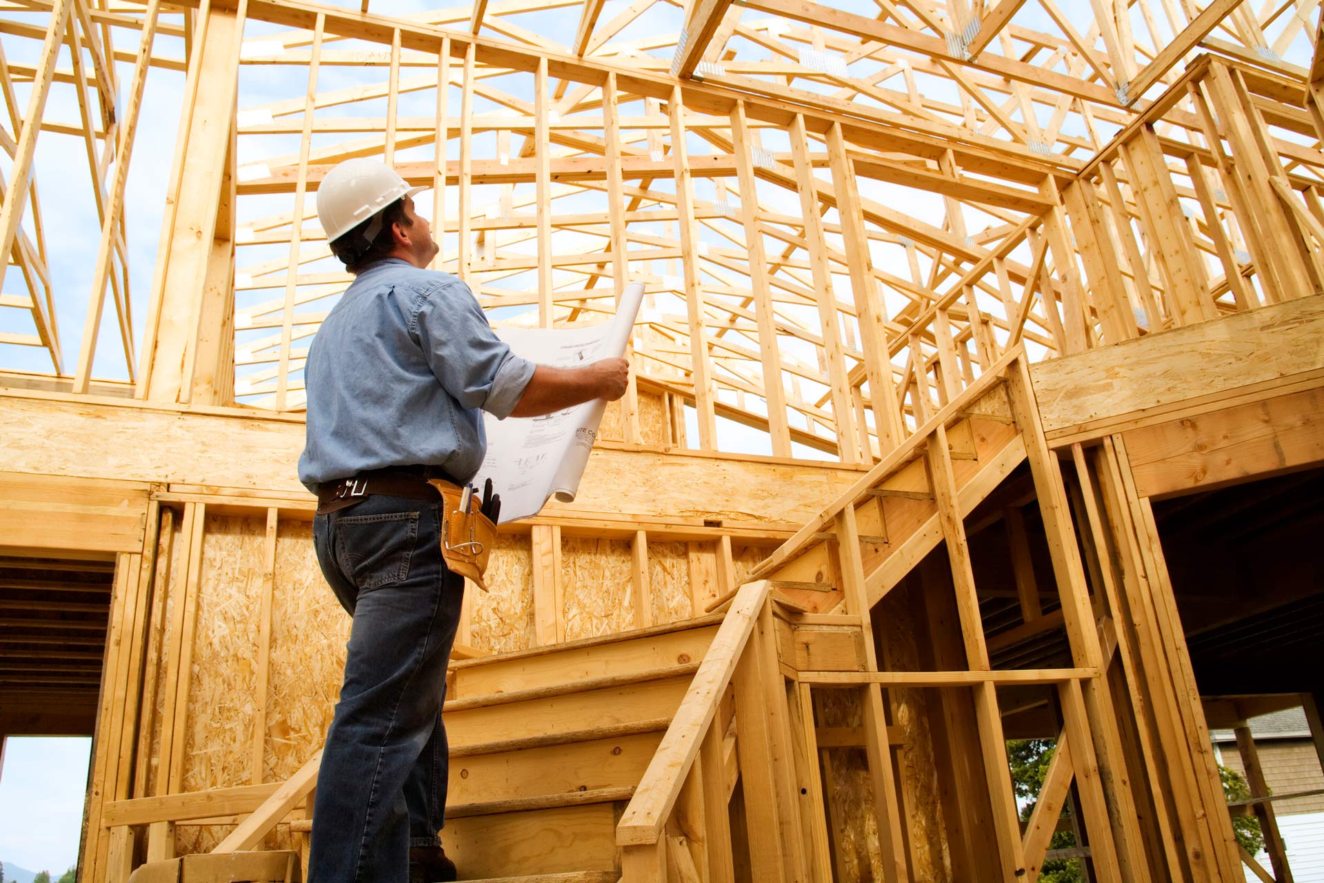 Photo of a Construction Worker Reviewing a Set of Building Plans | Brisbane, Qld | Virginia Building Supplies Photo of a Construction Worker Reviewing a Set of Building Plans | Brisbane, Qld | Virginia Building Supplies