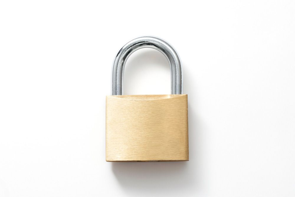 A brass padlock with a chrome hook on a white background — Locksmith in Helensvale, QLD