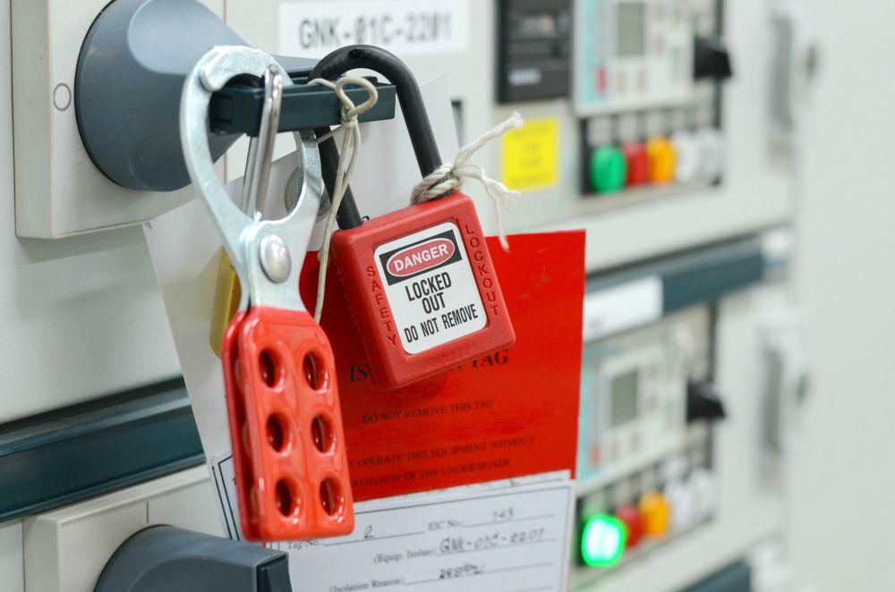 A red padlock that says danger locked out do not remove — Locksmith in Tweed Heads, NSW