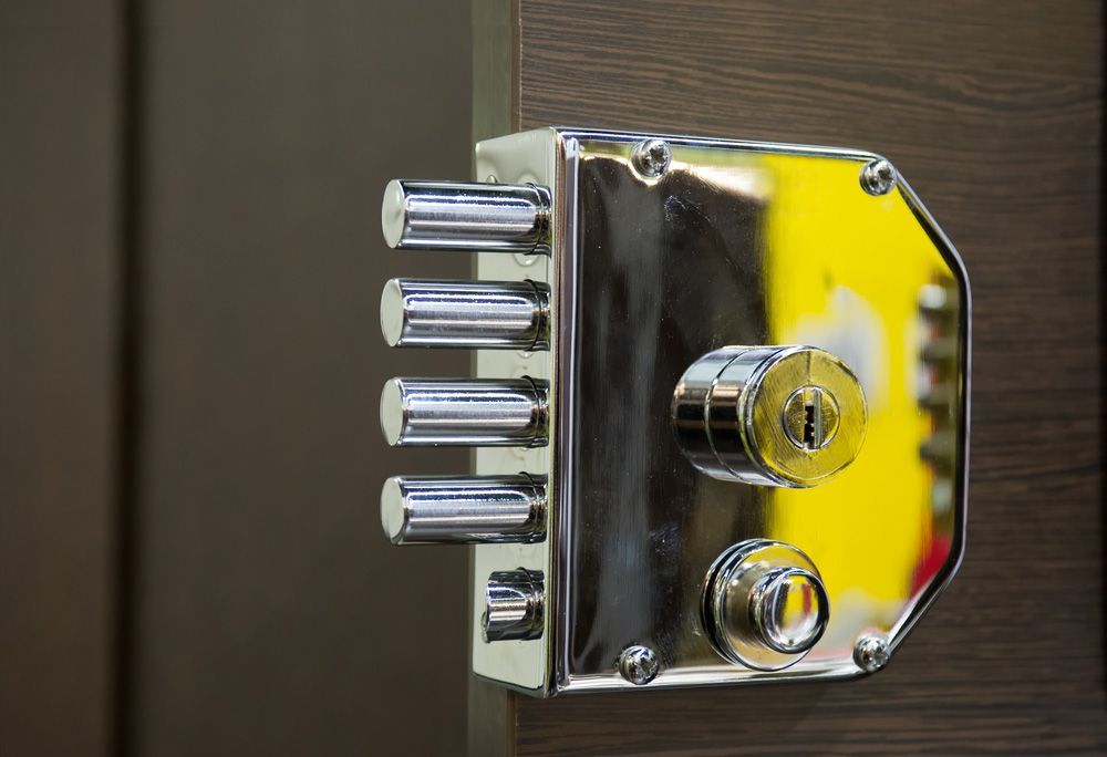 A close up of a door lock on a wooden door — Locksmith in Tweed Heads, NSW