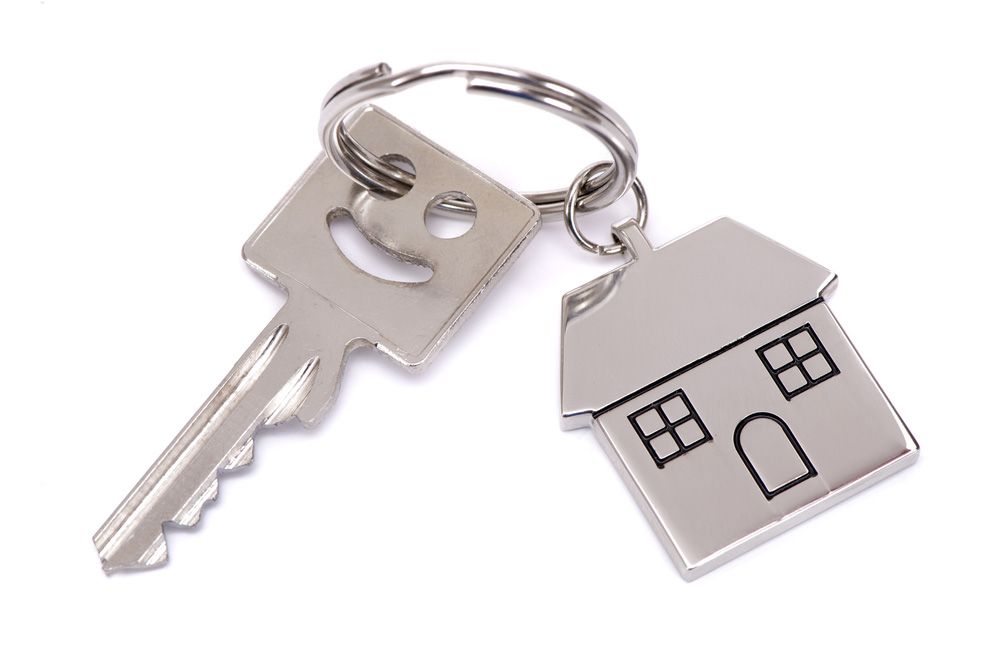 A key with a house keychain attached to it — Locksmith in Surfers Paradise, QLD