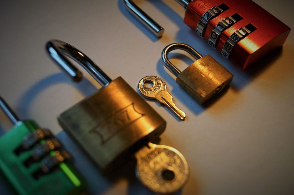 A bunch of locks and keys one of which has the letter t on it — Locksmith in Tweed Heads, NSW