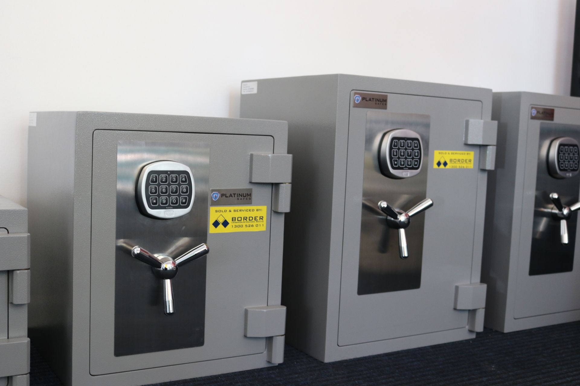 A hand is reaching into a safe with the numbers 123 on it — Locksmith in Tweed Heads, NSW