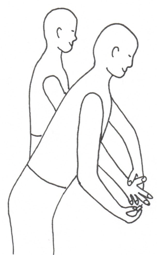 Two people standing, one leaning forward with hands clasped, stretching or bowing.