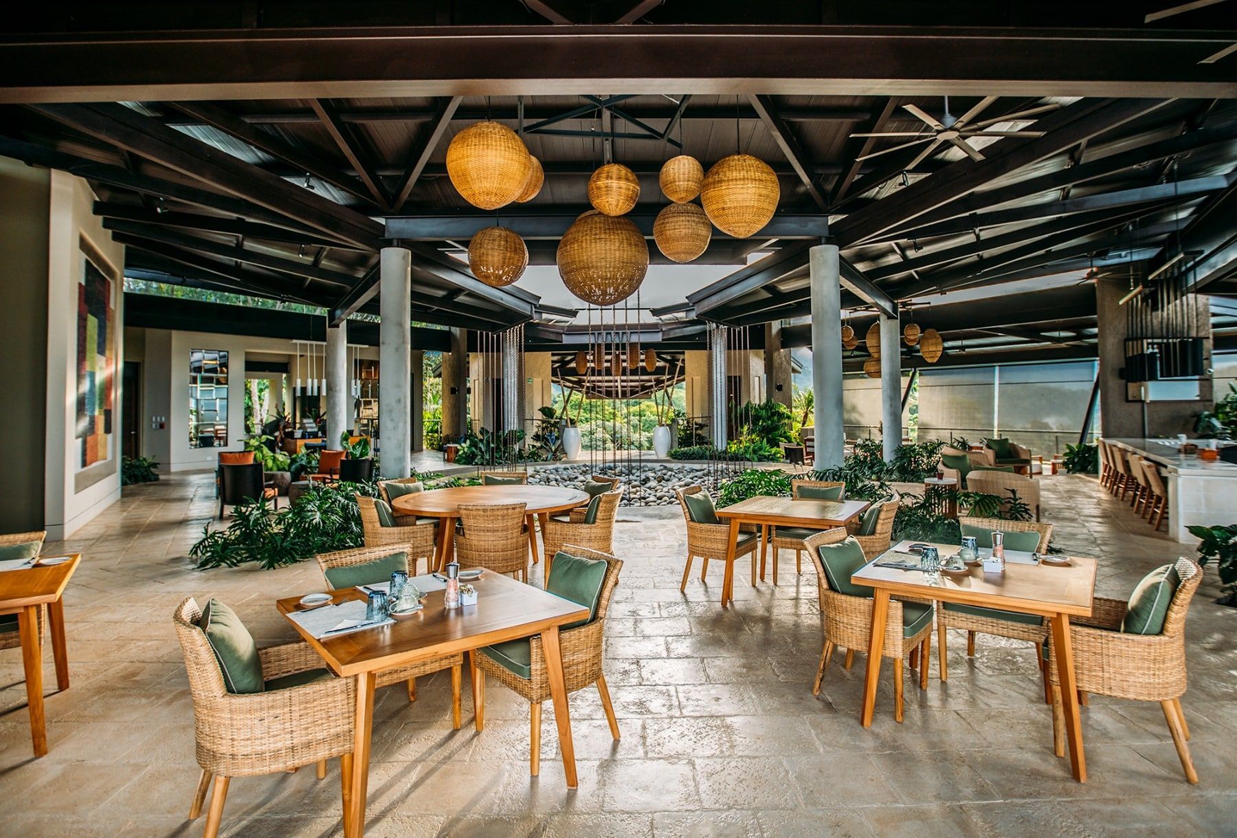 There are many tables and chairs in the restaurant.