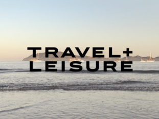 A picture of a beach with the words travel + leisure on it