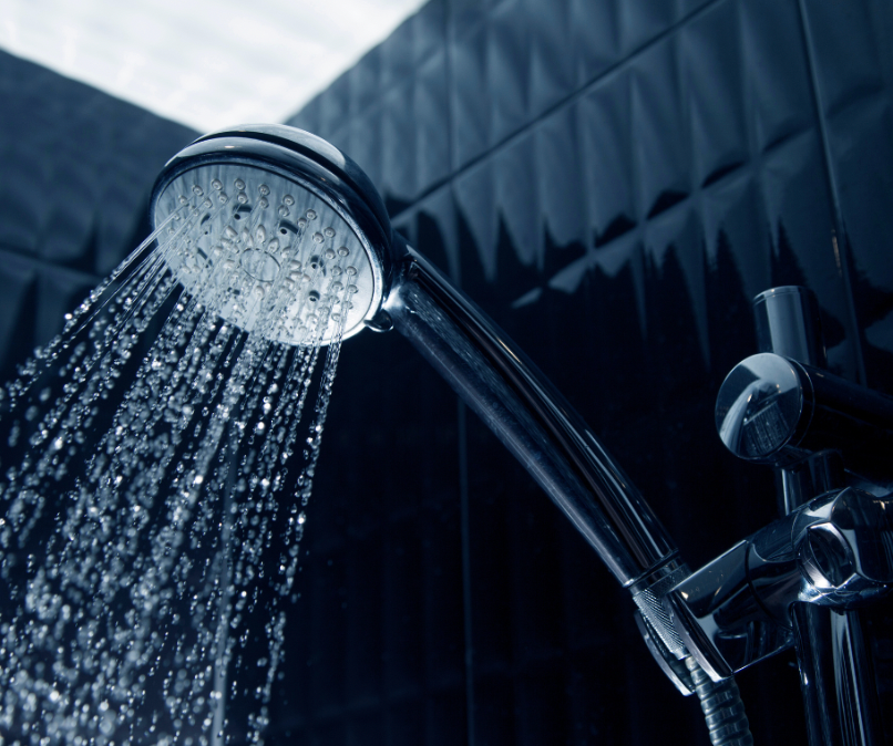 Small white shower head turned on