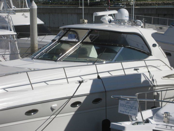 A white boat with the word prestige on the side