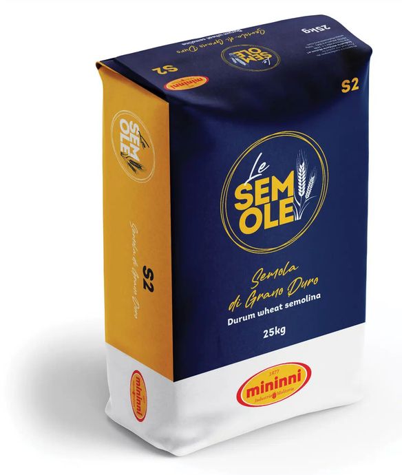 Blue and gold Sem Olé packaged coffee bag on a white background