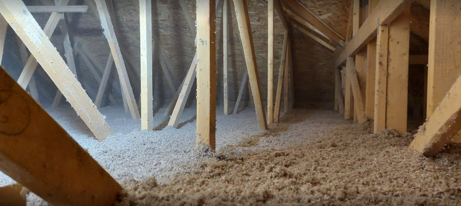 There is a lot of wood in the attic of a house.