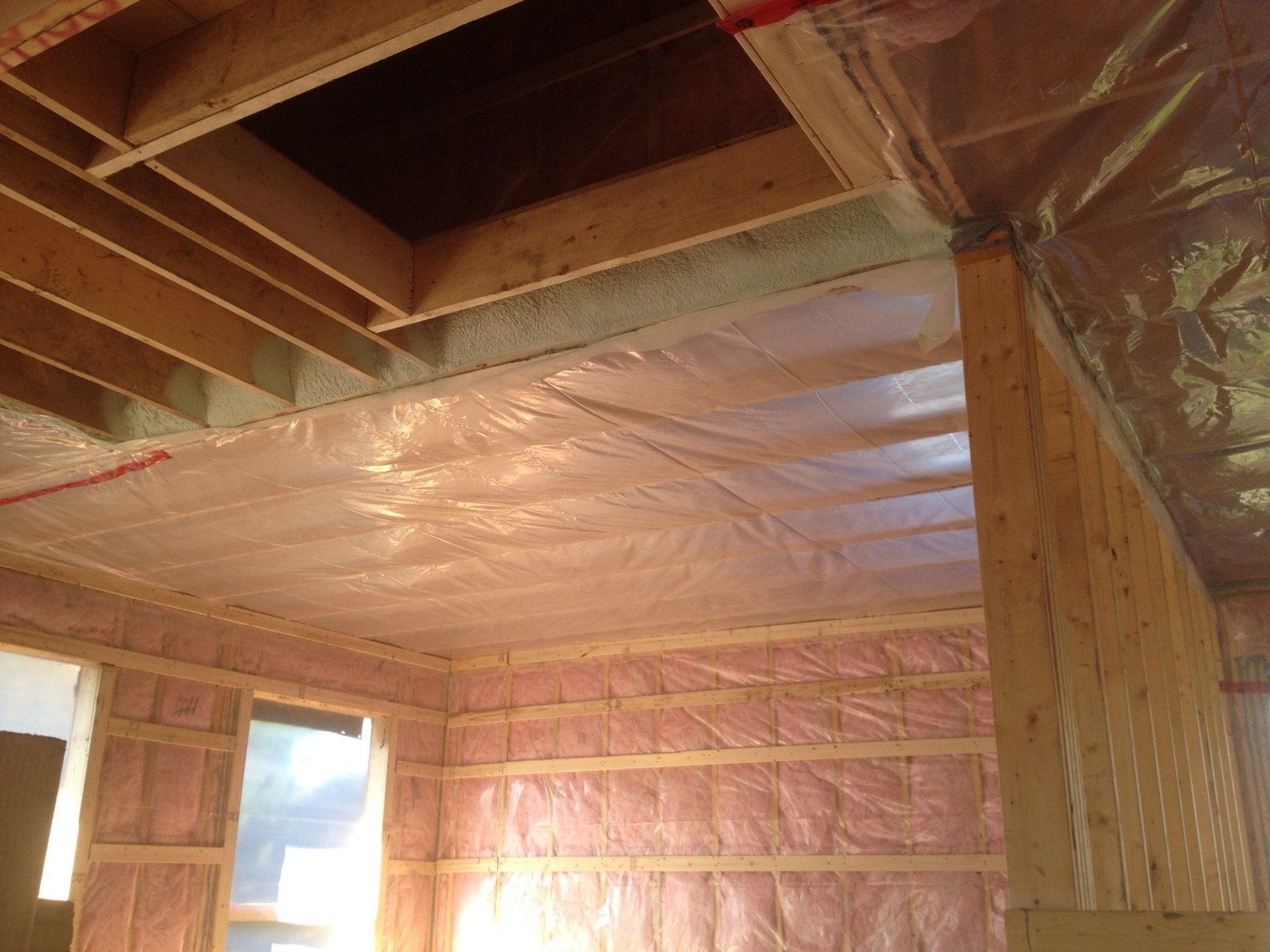 A room with a ceiling that is covered in plastic.