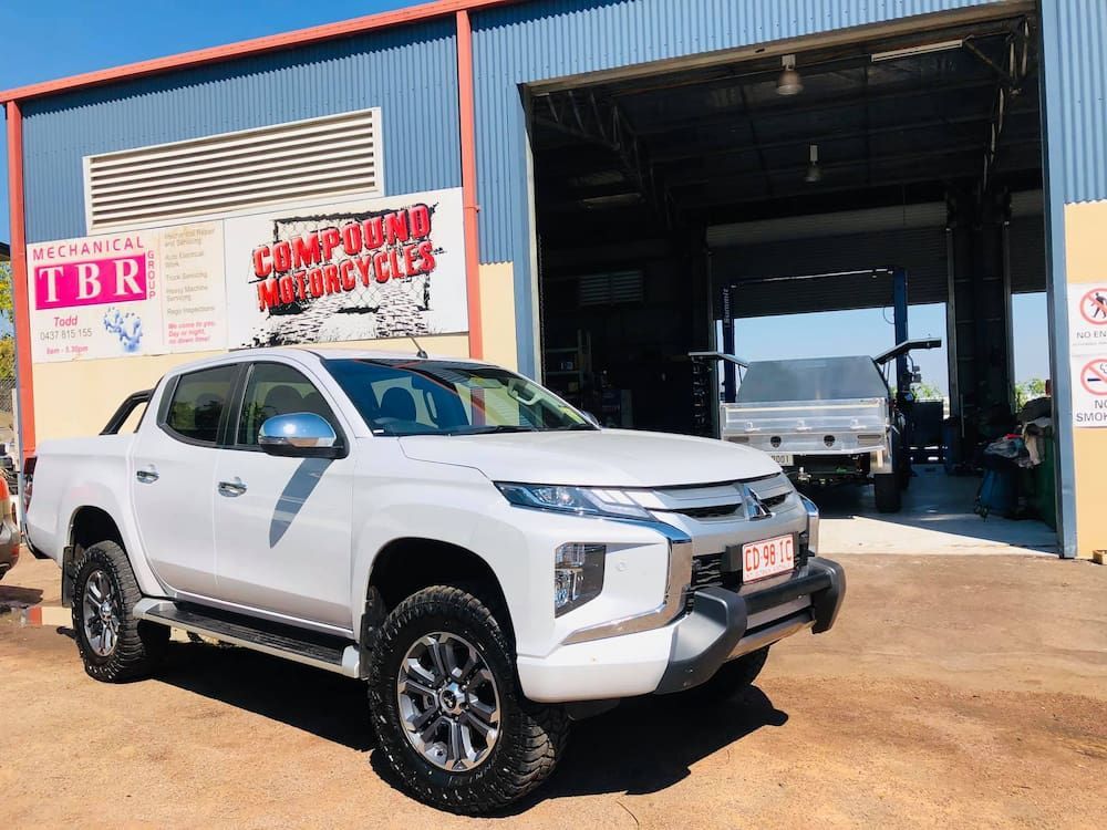 A White Truck Is Parked In Front Of A Building — TBR Mechanical in Adelaide River, NT