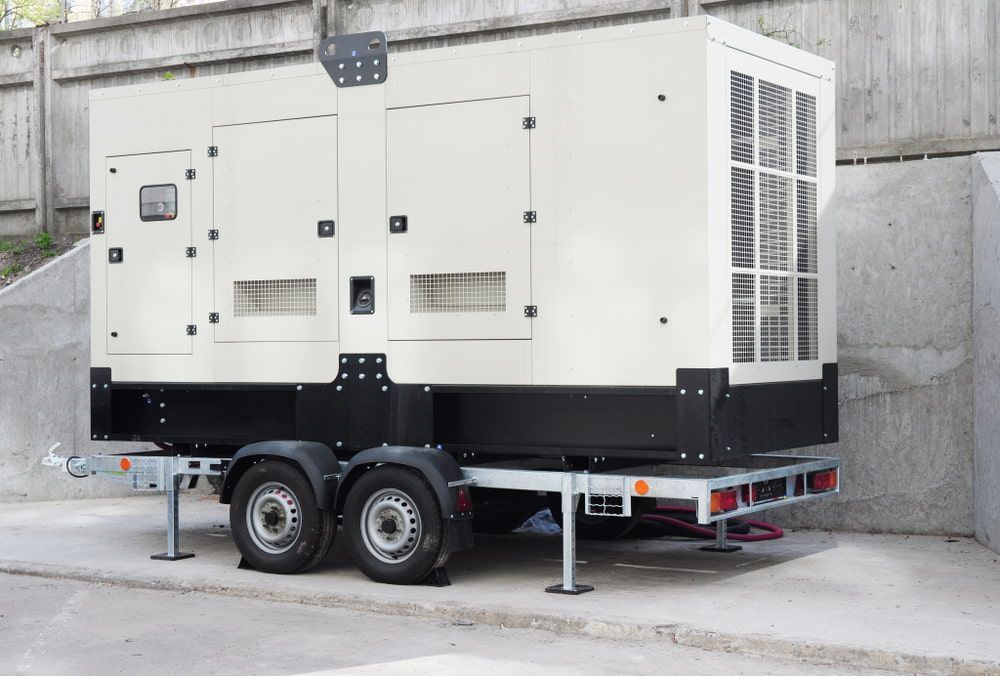 A Generator Is Sitting On A Trailer In A Parking Lot — TBR Mechanical in East Arm, NT