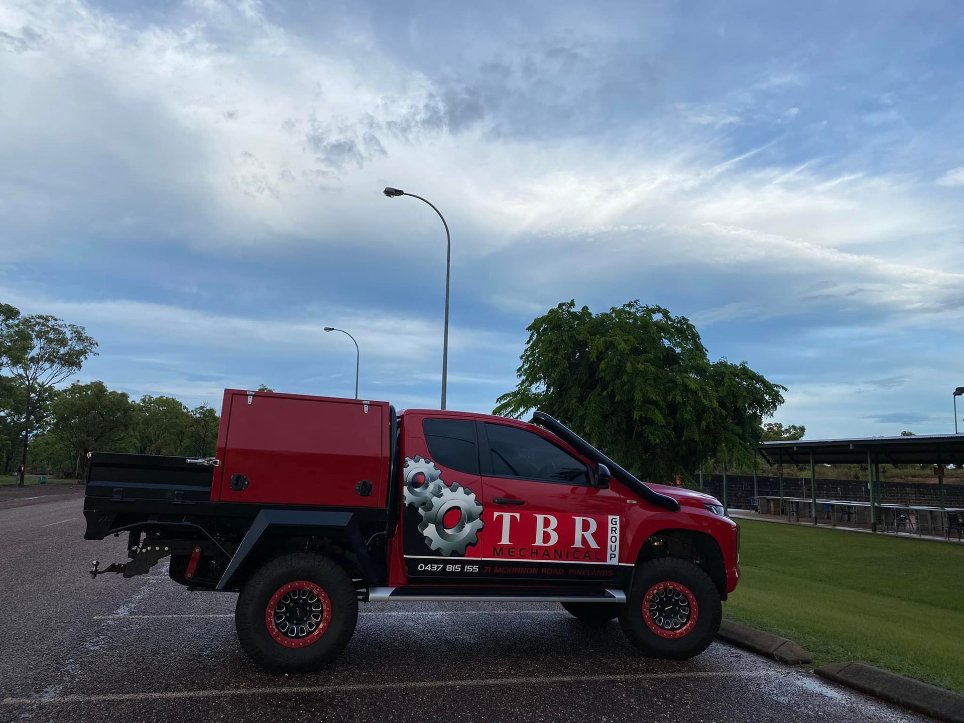 A Man Is Working On The Windshield Of A Vehicle — TBR Mechanical in East Arm, NT